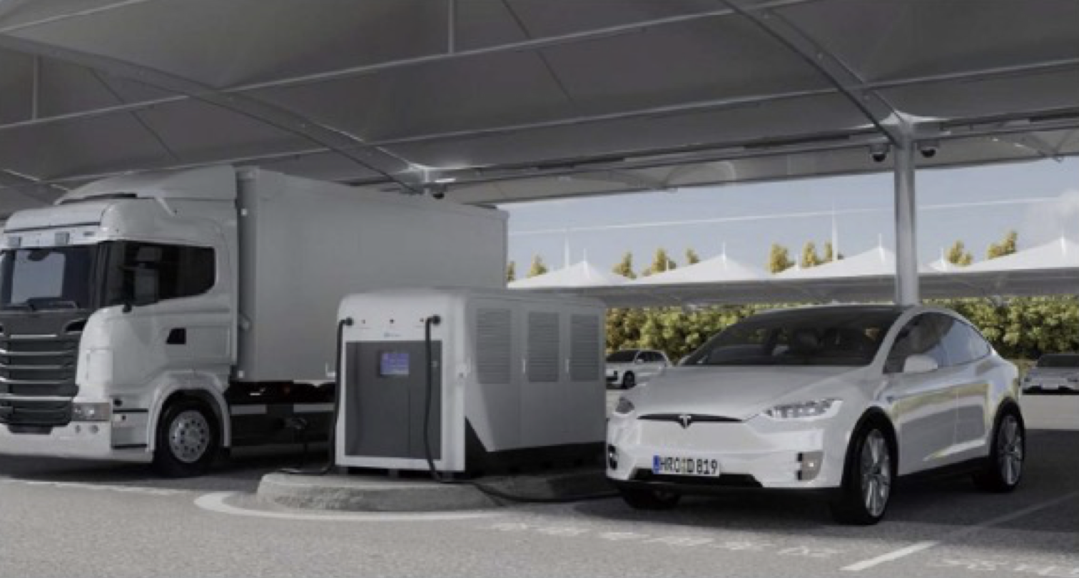 QiTrailer mobile DC fast charger deployed under a carport charging a truck and an electric SUV